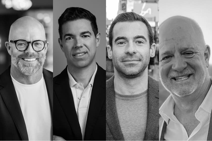 Black and white composite portrait showing four professional men side by side, each in business attire with neutral backgrounds.